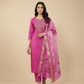 Woman wearing a pink traditional outfit with a matching dupatta on a beige background